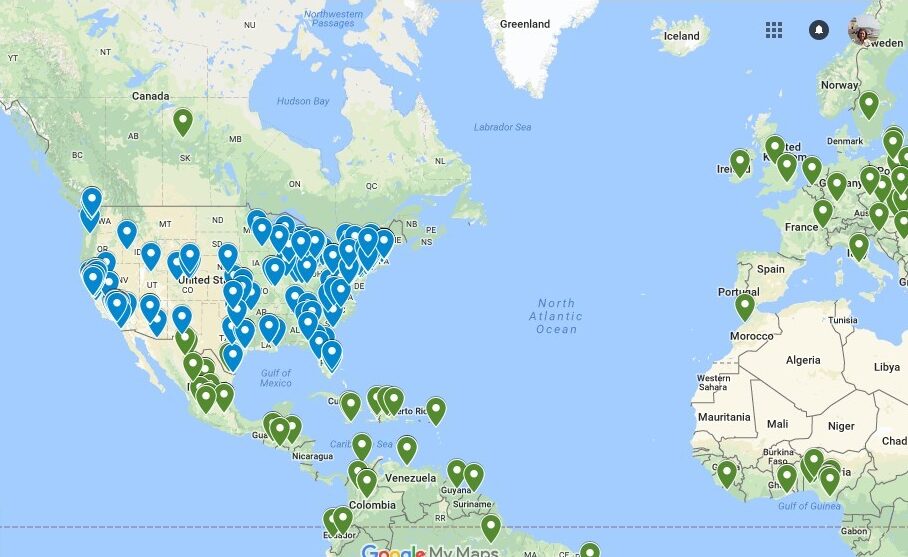 World map with blue pins representing where fellows and their families immigrated to and green pins representing where fellows and their families are from