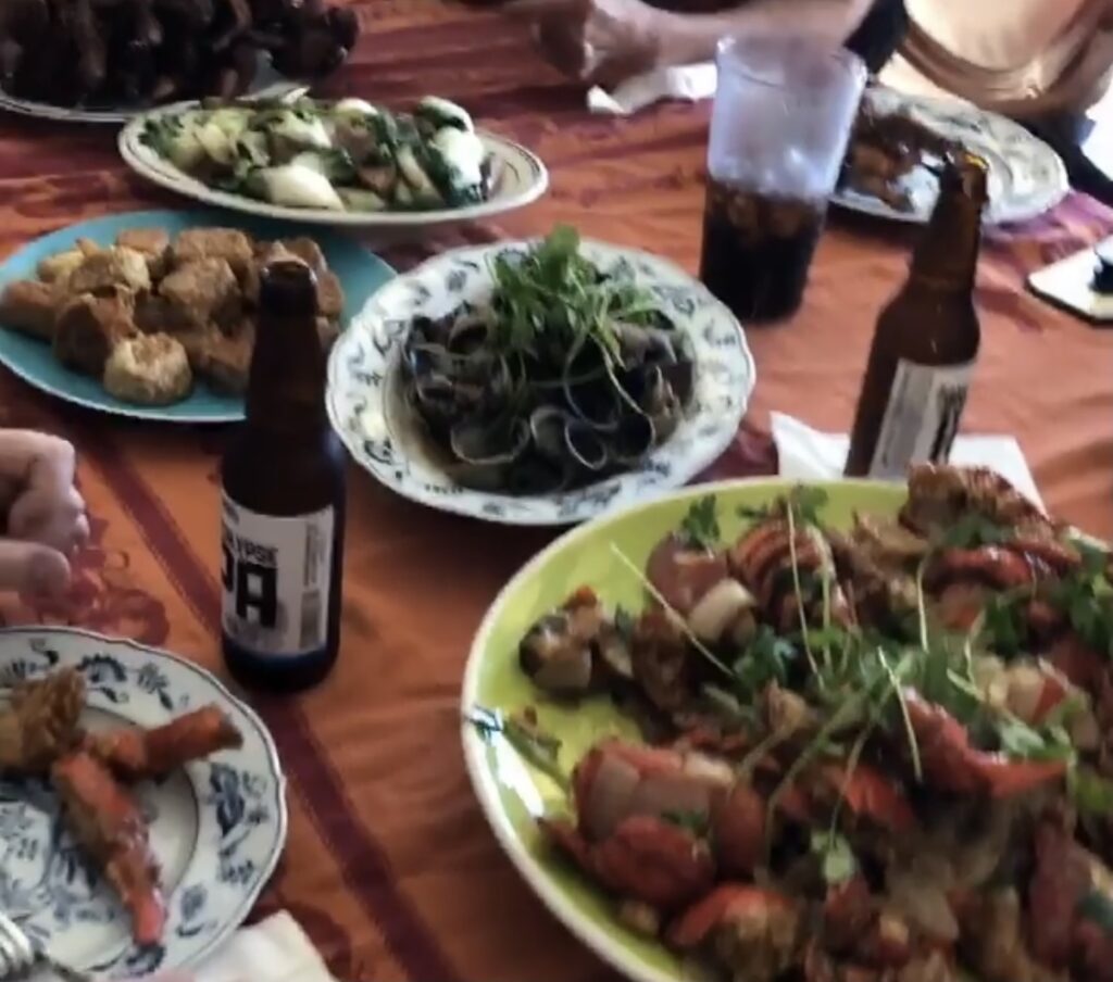 Photograph of a lot of food set out on a table.