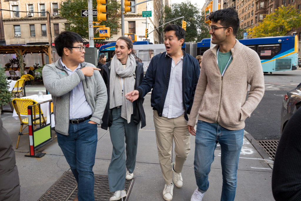 Kingson Lin walks with three other Fellows in New York City as part of the 2023 Fall Conference.