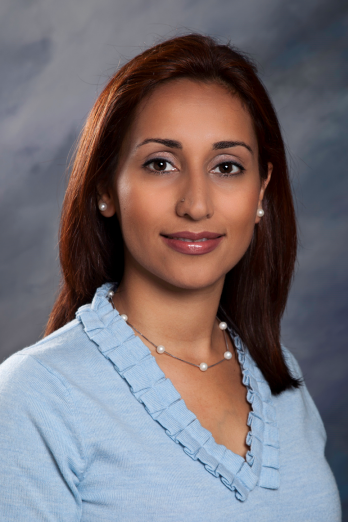 Diana S. Sepehri-Harvey headshot - wearing a blue top. 